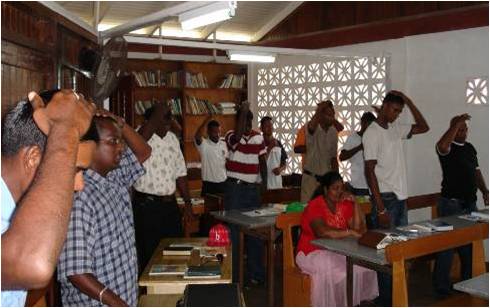 Students doing hand signs